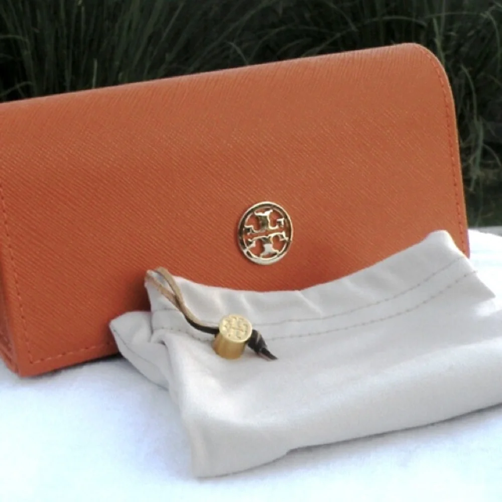 Tory Burch “Cranberry” sunglasses - New with case and dust bag.